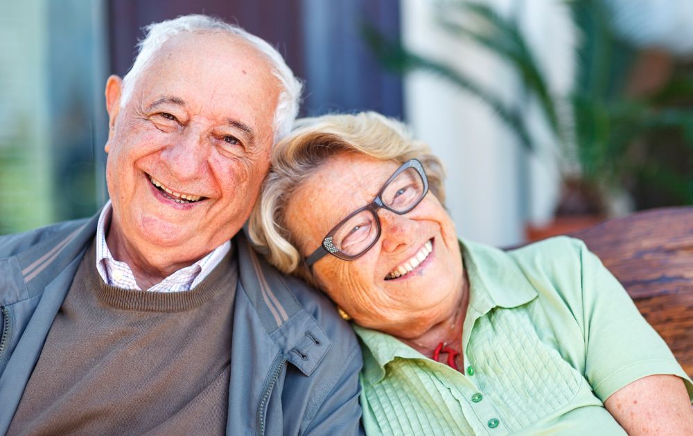 elderly couple smiling together